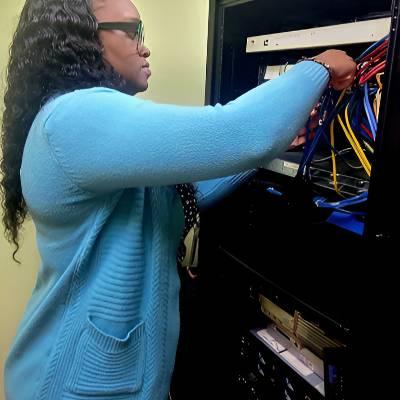 Systems Engineer working on a networking rack